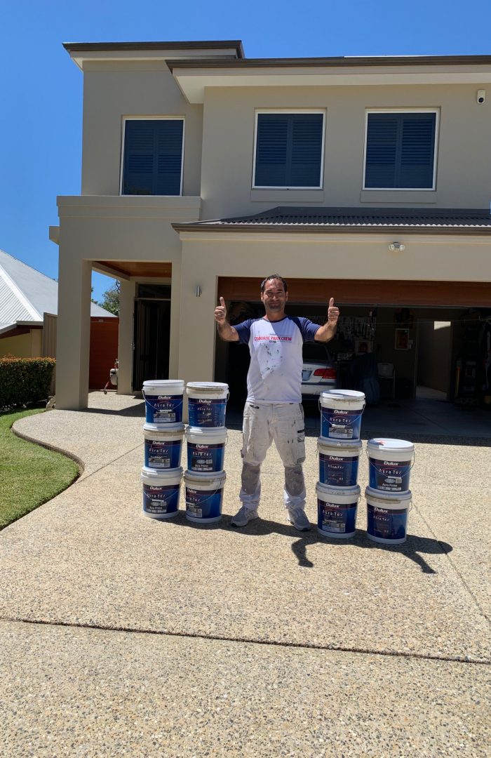 Professional Perth painters transform a modern home exterior with a fresh white paint job.